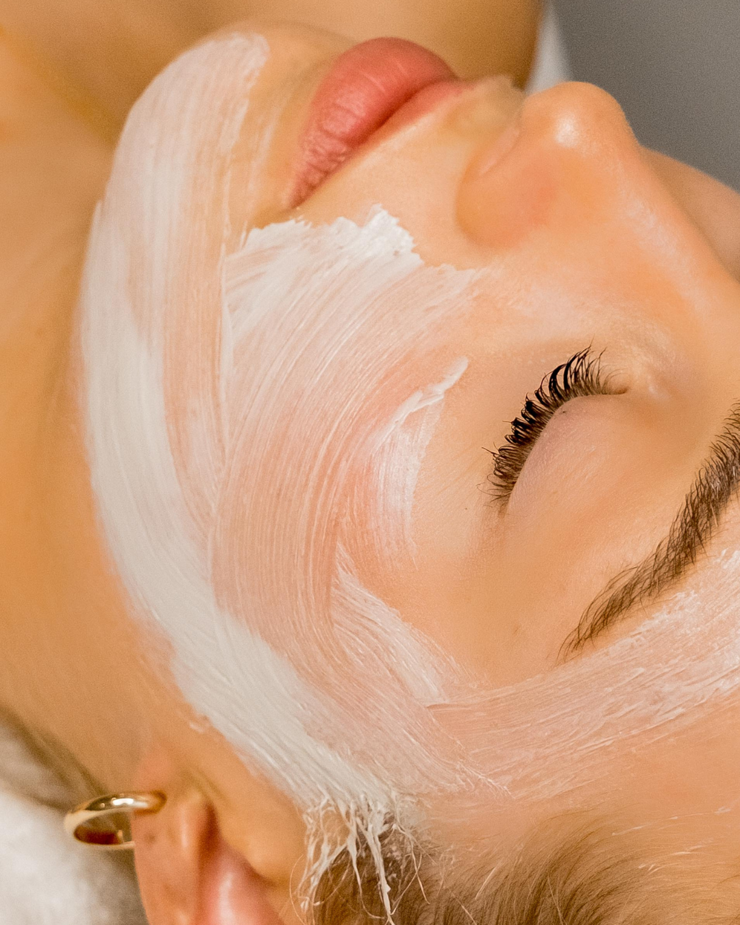 Woman enjoying a relaxing facial treatment at the start of the new year.