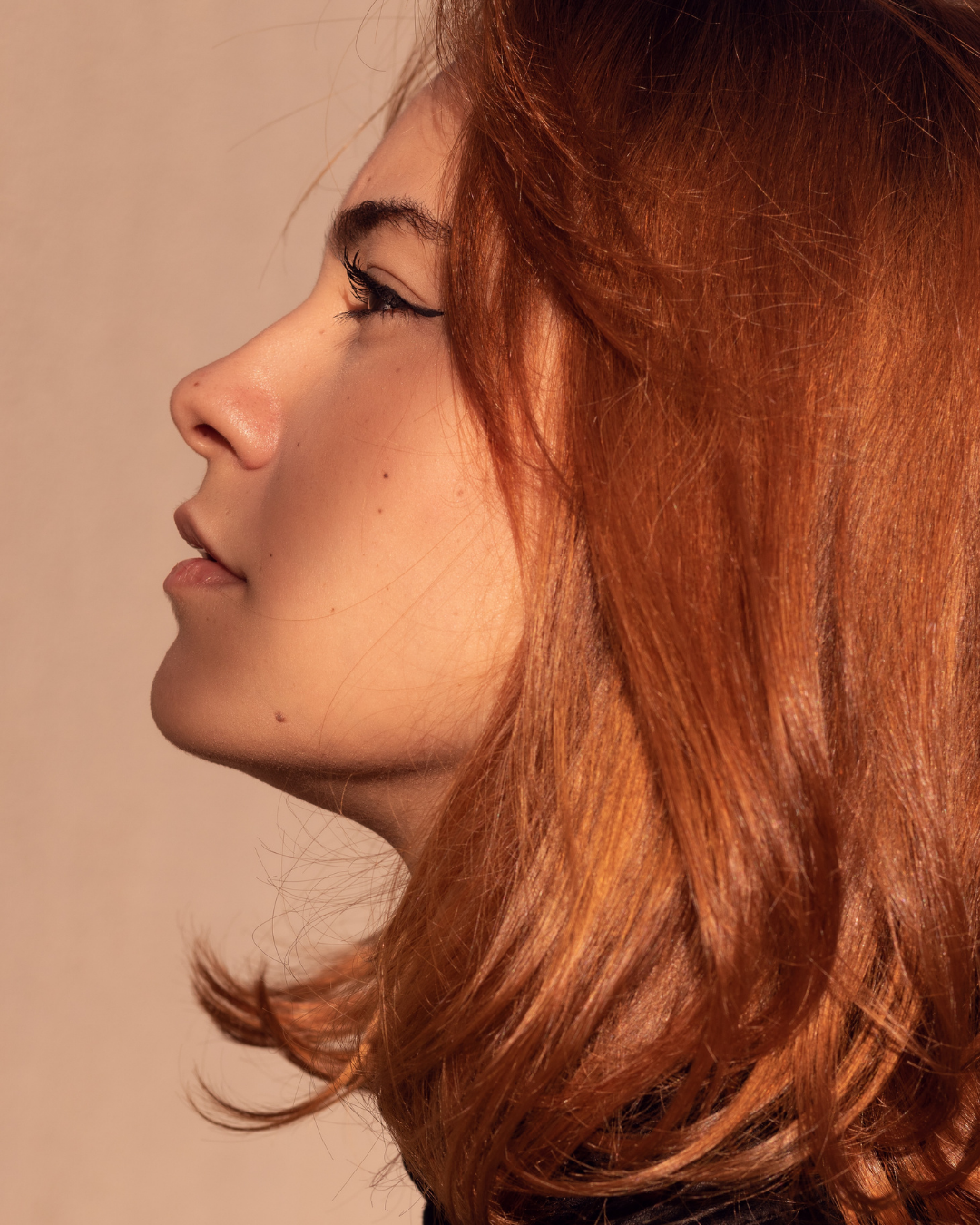 woman with glowing skin and hair from Reveal