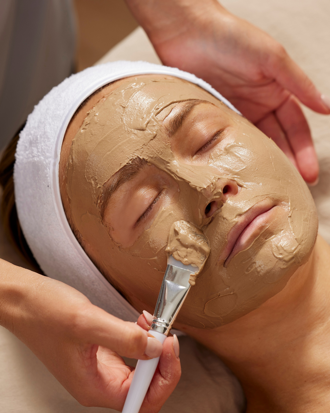 Therapist applying a gentle peel treatment in spa setting