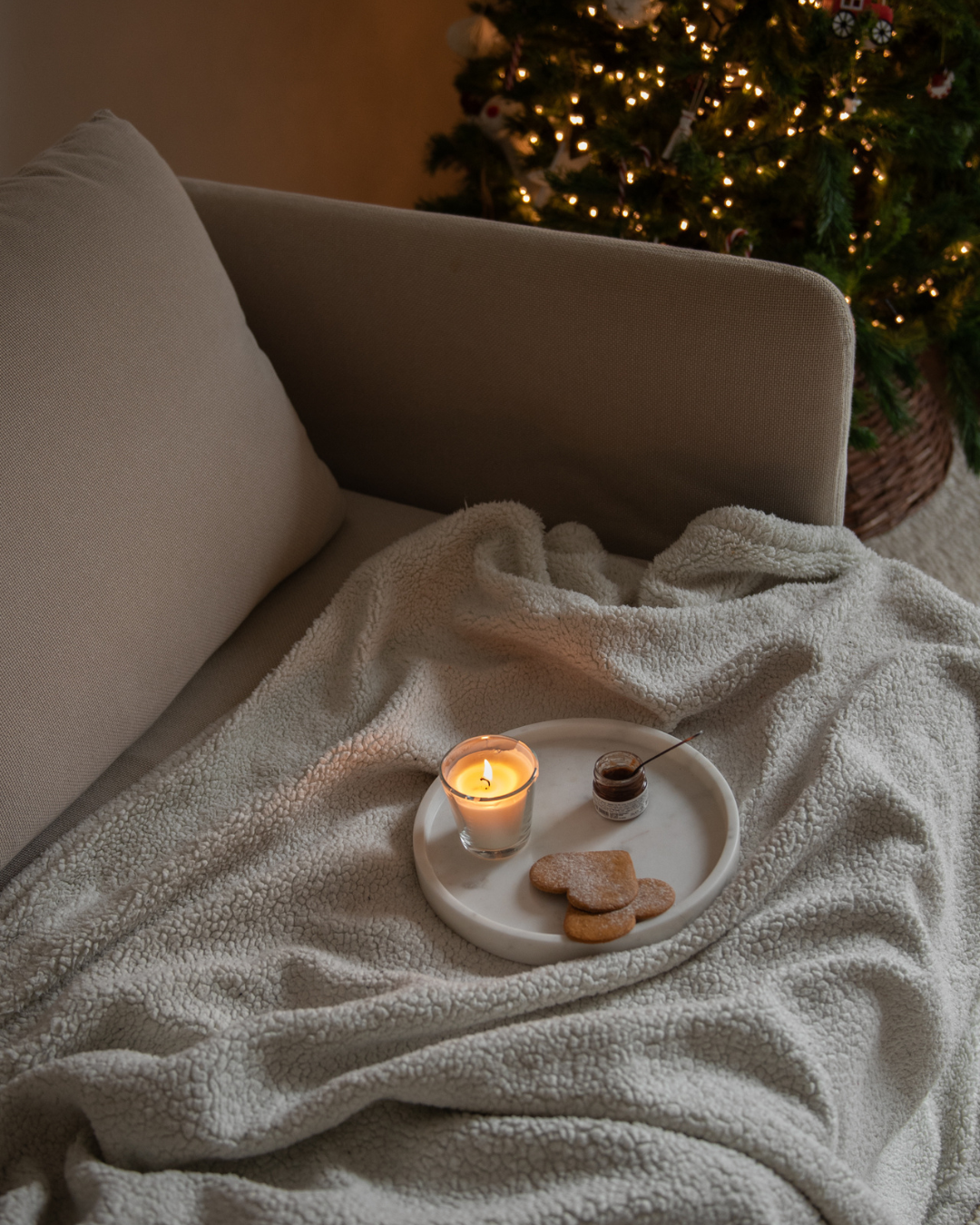Woman applying a hydrating face mask during the busy Christmas season.